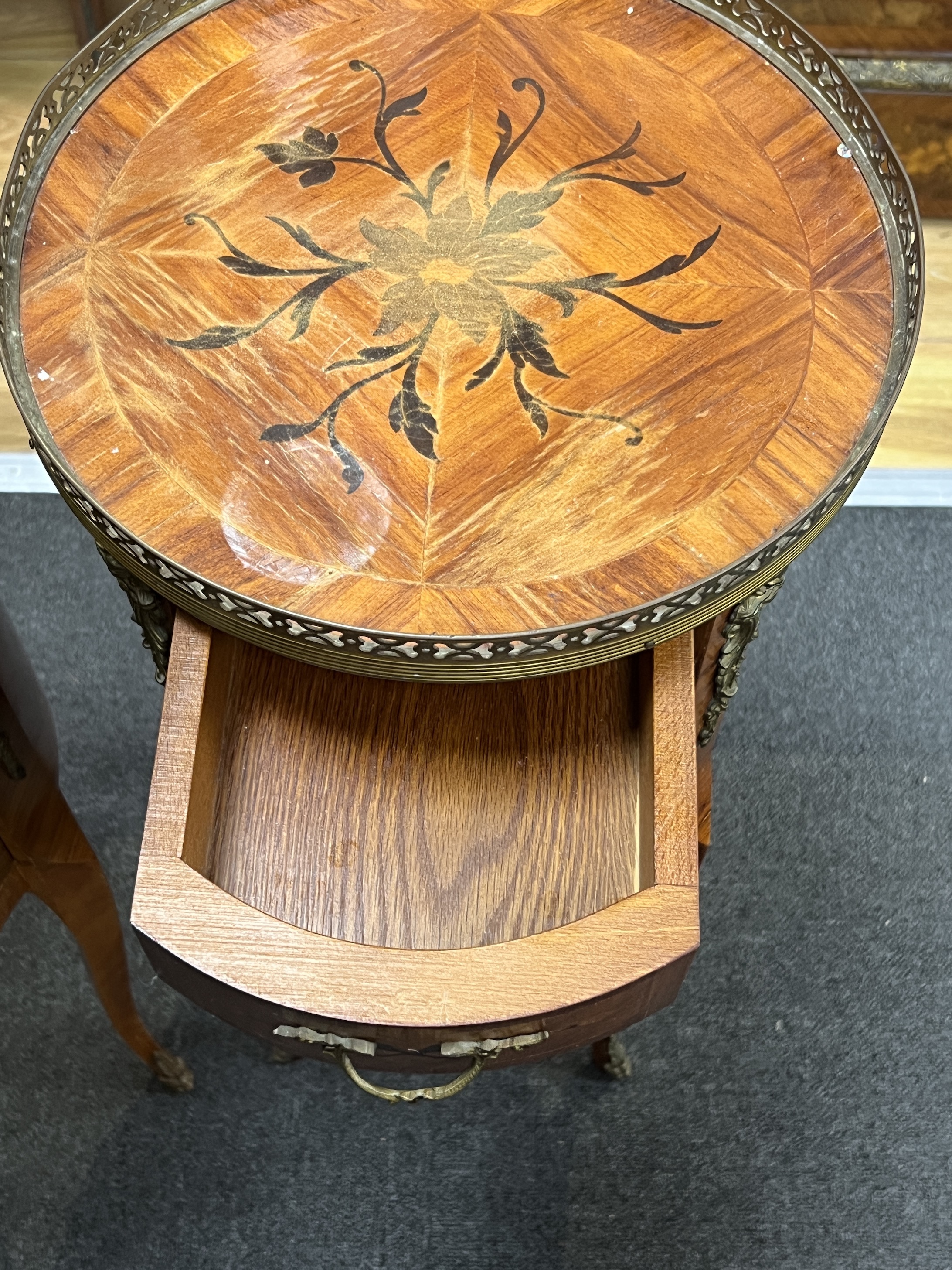 A pair of marquetry inlaid circular kingwood bedside chests, diameter 32cm, height 73cm